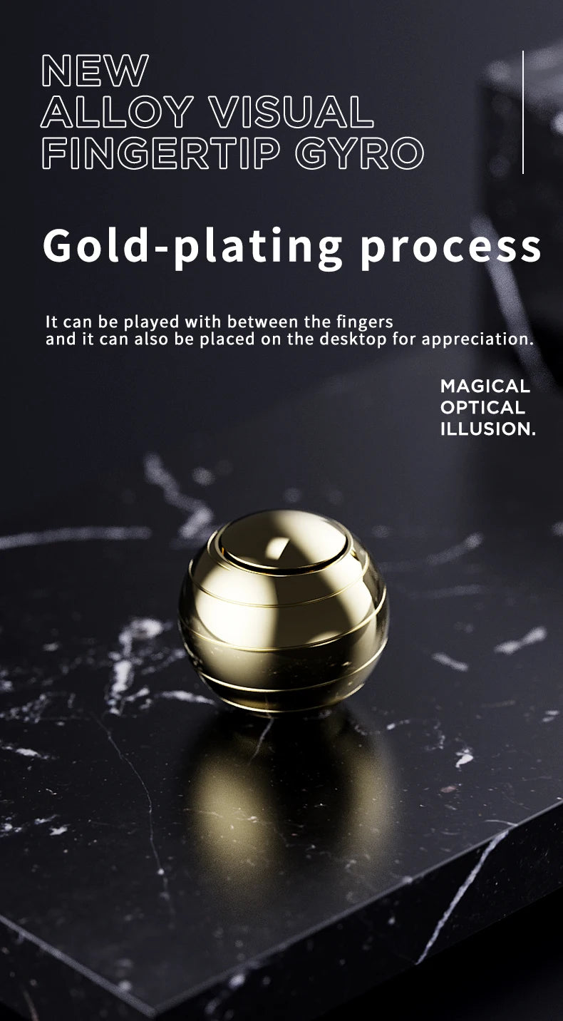 A gold-plated metal fidget spinner resting on a dark marble surface.