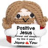 Handmade crochet Jesus doll with brown hair and white accents, featuring a sign that reads Positive Jesus Forever and always 