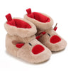 Pair of tan faux fur baby first walker shoes with red accents and ear flaps