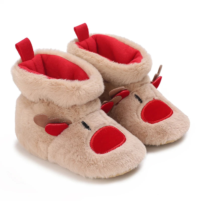 Pair of tan faux fur baby first walker shoes with red accents and ear flaps
