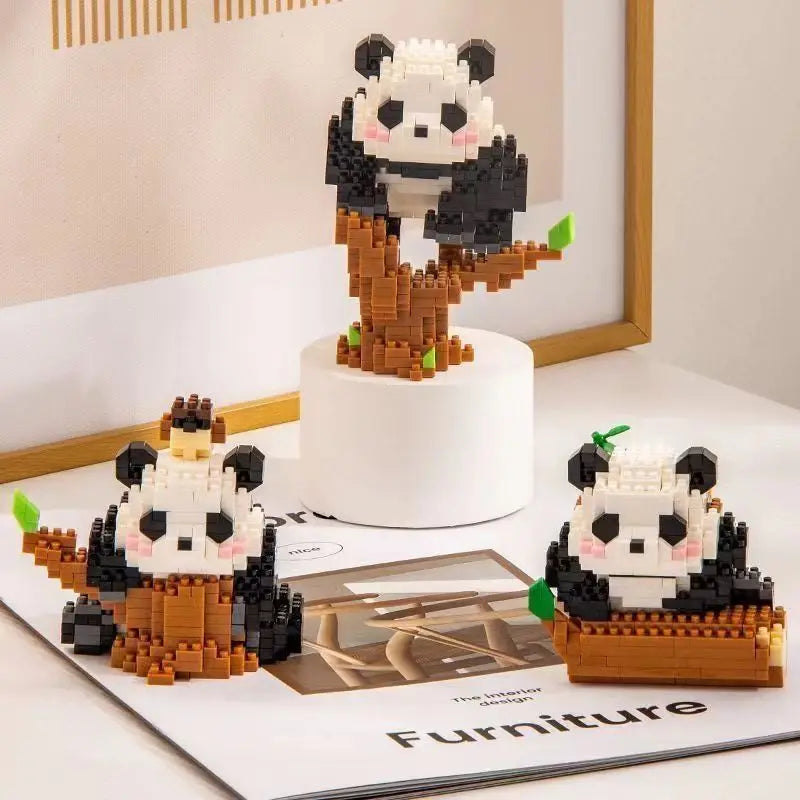 A mini panda building block set featuring black and white figures with brown accents displayed on a white stand.