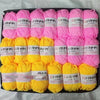 A pack of pink and yellow acrylic yarn skeins for knitting, crochet, and DIY crafts.