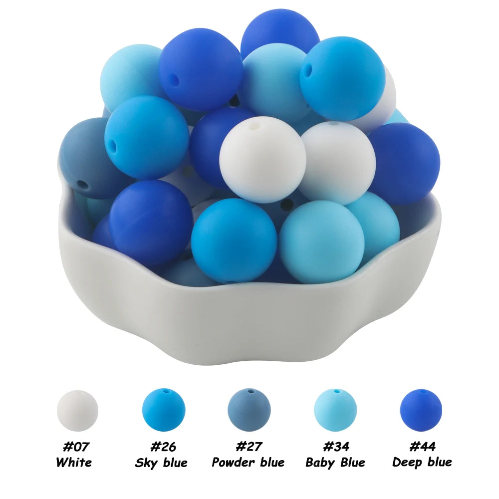 A bowl filled with 50 silicone beads in various shades of blue and white for DIY jewelry making