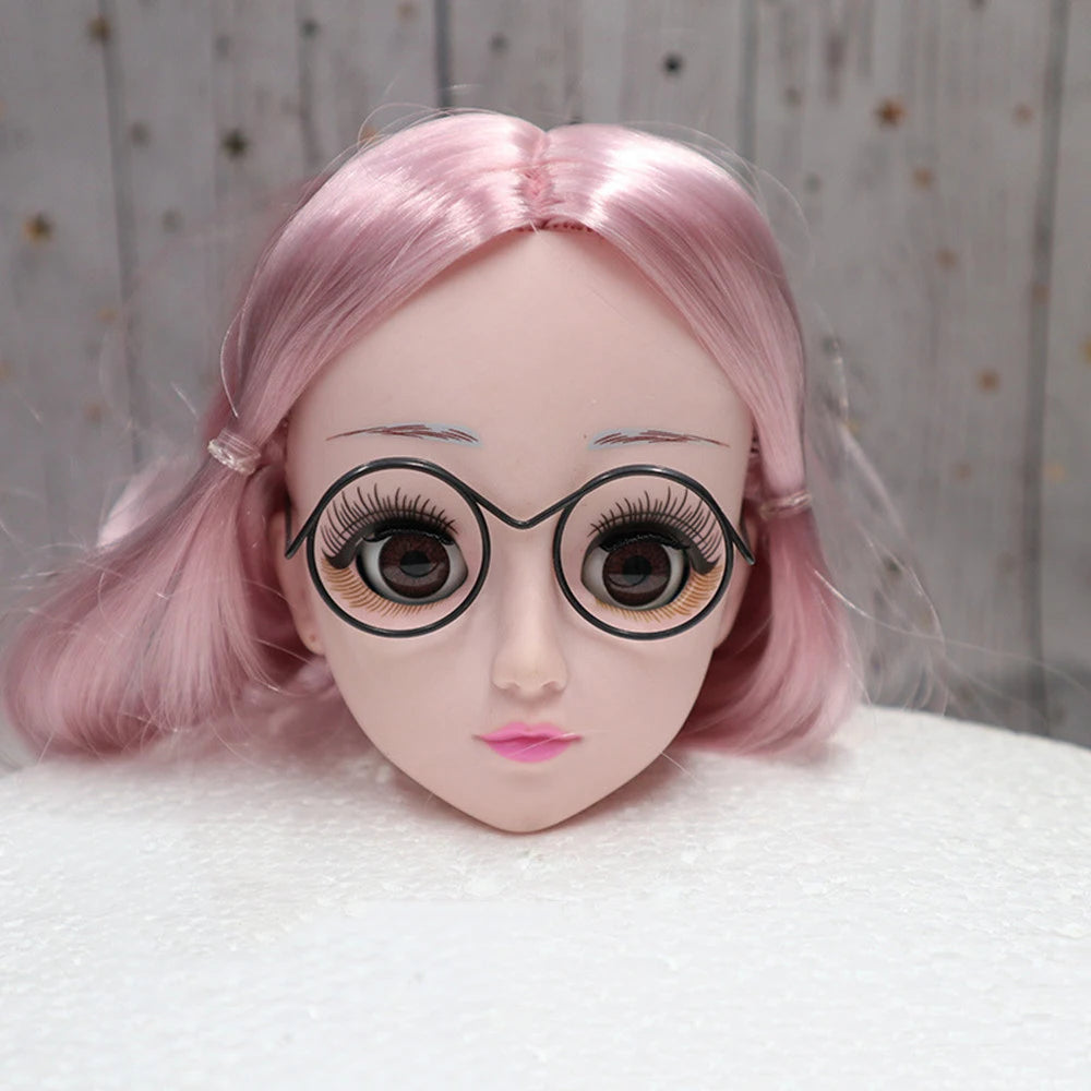 A close-up of a doll's face with pink hair and round black metal glasses frames.