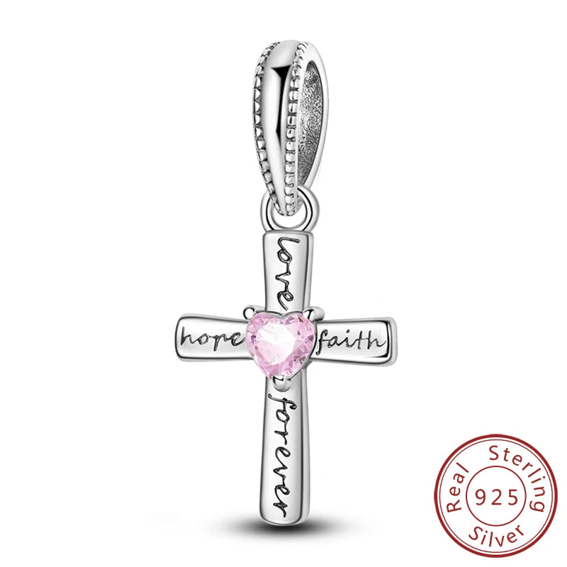 Sterling silver cross charm with hope faith and forever engraved on the design
