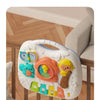A white musical baby piano playmat with a light-up keyboard and hanging toys is shown attached to a crib.