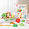 A box of a wooden salad play toy set containing various fruit and vegetable shapes for children.