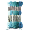 A set of six skeins of vibrant embroidery thread in various shades of teal and blue for cross stitch and DIY crafts.