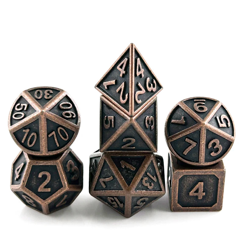A set of premium metal polyhedral dice featuring a dark bronze finish and multicolor gold accents.
