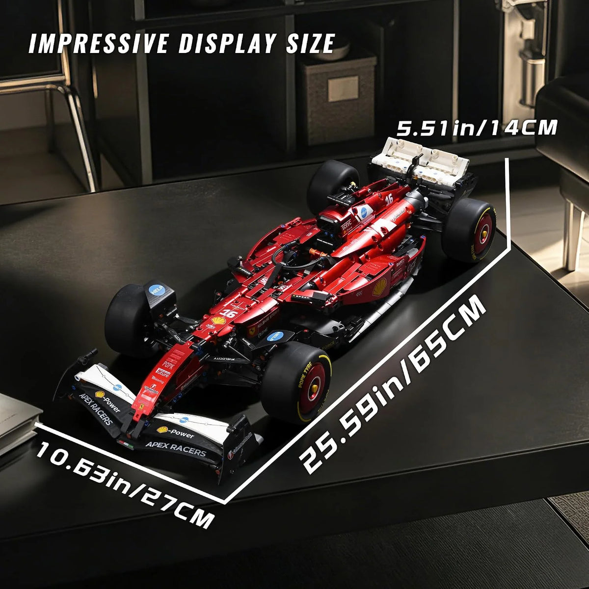 A red and black 1:8 scale open-wheel racing car model is displayed on a dark surface with size measurements.