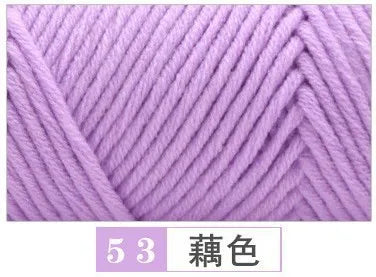 Close-up of a skein of light purple premium milk cotton yarn knitted into a textured fabric.
