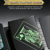 A black box of playing cards featuring a green design is displayed on a dark surface.
