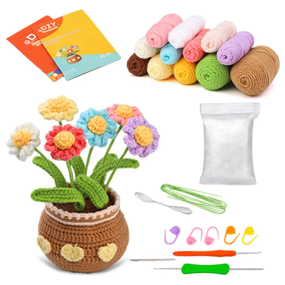 A DIY crochet kit for a potted plant featuring yarn balls, flowers, and tools.