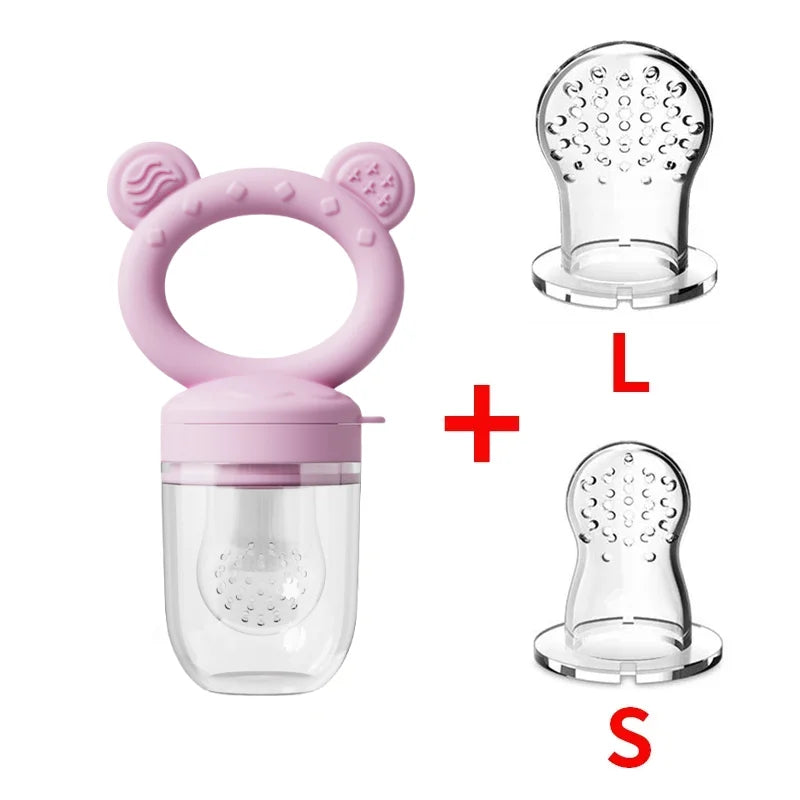 A set of pink silicone fruit food feeders, including a bear-shaped mold and a clear silicone insert.