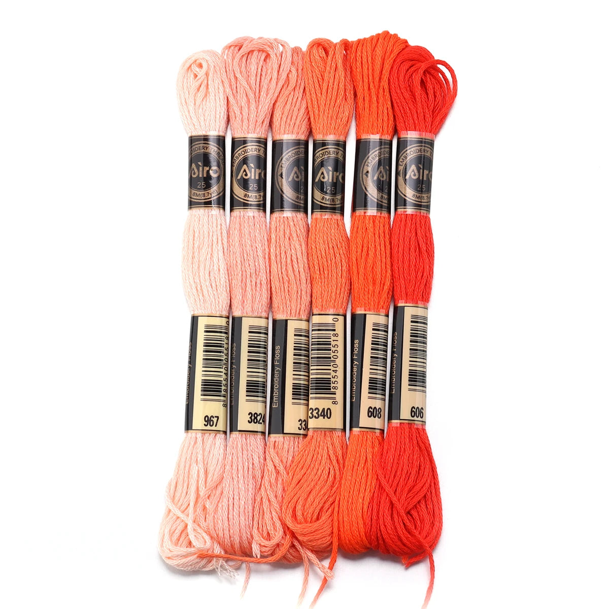 A set of six skeins of vibrant orange embroidery thread for cross stitch and DIY crafts