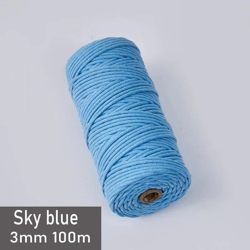 A spool of sky blue 3mm cotton macrame cord measuring 100 meters.