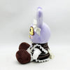 A purple plush doll resembling a character from The Amazing Digital Circus with yellow eyes and a white ribbon.