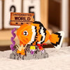 An orange and black shark building block model with purple tentacles and yellow accents on a gray base.