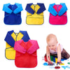 A set of colorful waterproof kids art and baking aprons with long sleeves shown in various shades of blue, yellow, and pink.