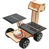 A wooden model kit of a solar-powered lunar rover featuring solar panels and wheels.