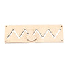 A light wooden Montessori busy board featuring a castle and bulldozer theme with wavy cutouts.