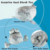 Surprise Seal Plush Toy showing a Mommy Seal and a Happy Seal Family with an open belly zipper.