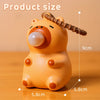 An orange capybara squeeze toy with a bubble blower feature shown from the side.