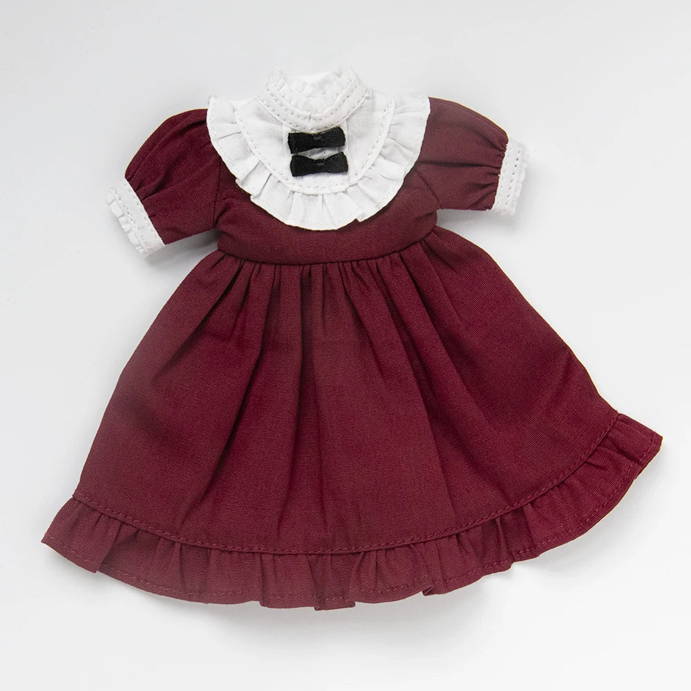 A vintage lace maid dress set for 1/6 scale dolls featuring a maroon dress with white lace trim and a black bow.