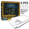 Box of a 1000-piece starry night jigsaw puzzle with adhesive paper and six puzzle pieces