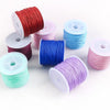 Rolls of 0.8mm cotton nylon macrame cord in various colors including red, pink, blue, and purple for jewelry making