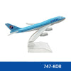 Diecast model of a Korean Air Boeing airplane in blue and white paint.