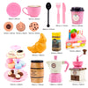 A pretend play tea party set featuring pink and yellow food items including cakes, coffee, and cups.