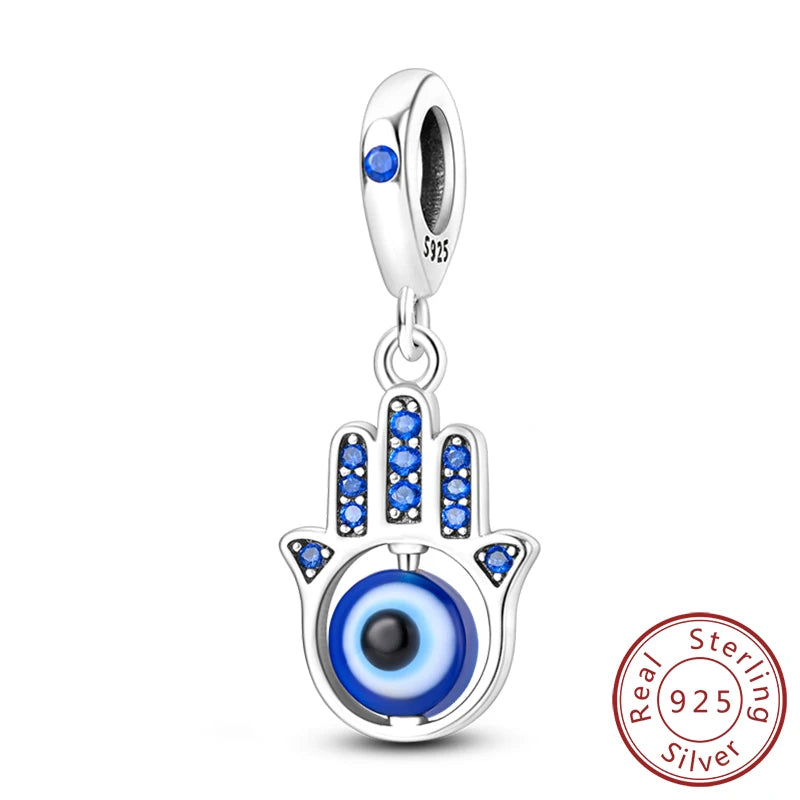 Sterling silver charm beads set featuring cross, angel, and evil eye designs for DIY jewelry making