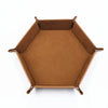 A brown hexagonal folding PU leather dice tray with a slightly raised rim.