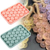 Silicone grape cluster mold in pink and green colors used for soap and candle making