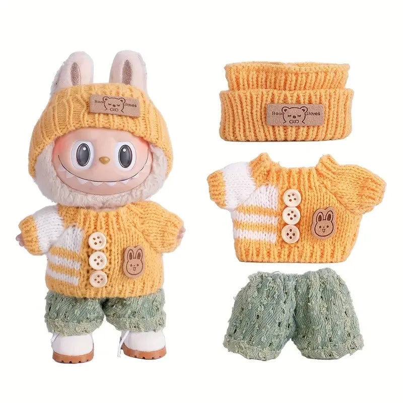 Adorable doll sweater outfit set featuring a yellow knitted top, green pants, and an orange knitted headband.