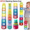 A set of nine colorful stacking cups featuring numbers, letters, and shapes for a game.