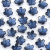 A collection of 50 small, blue glass beads shaped like cherry blossom flowers for jewelry making