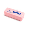 A pink butter stick squishy labeled 4oz salted butter with the word BUTTER on it.