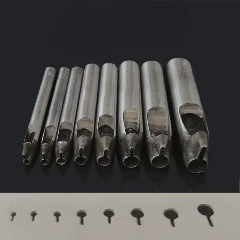 A row of precision leather hole punches for belts and crafting tools displayed on a dark surface.