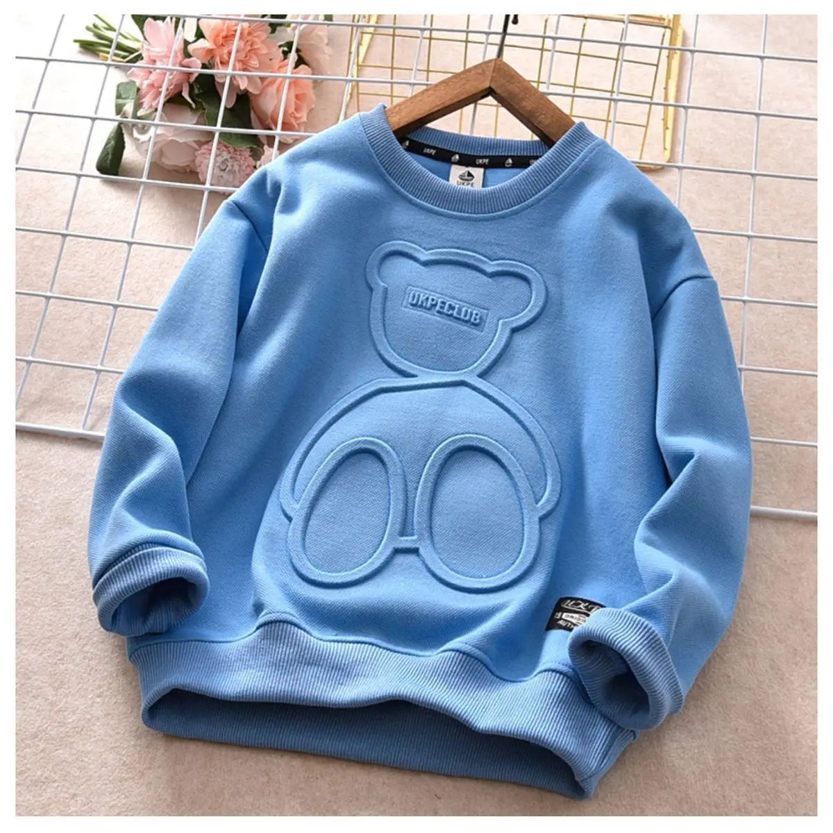Light blue kids cartoon bear pullover sweatshirt with a round design