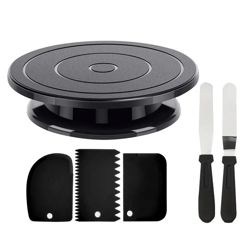 A black cake decorating kit featuring a rotating turntable, spatulas, and scrapers.