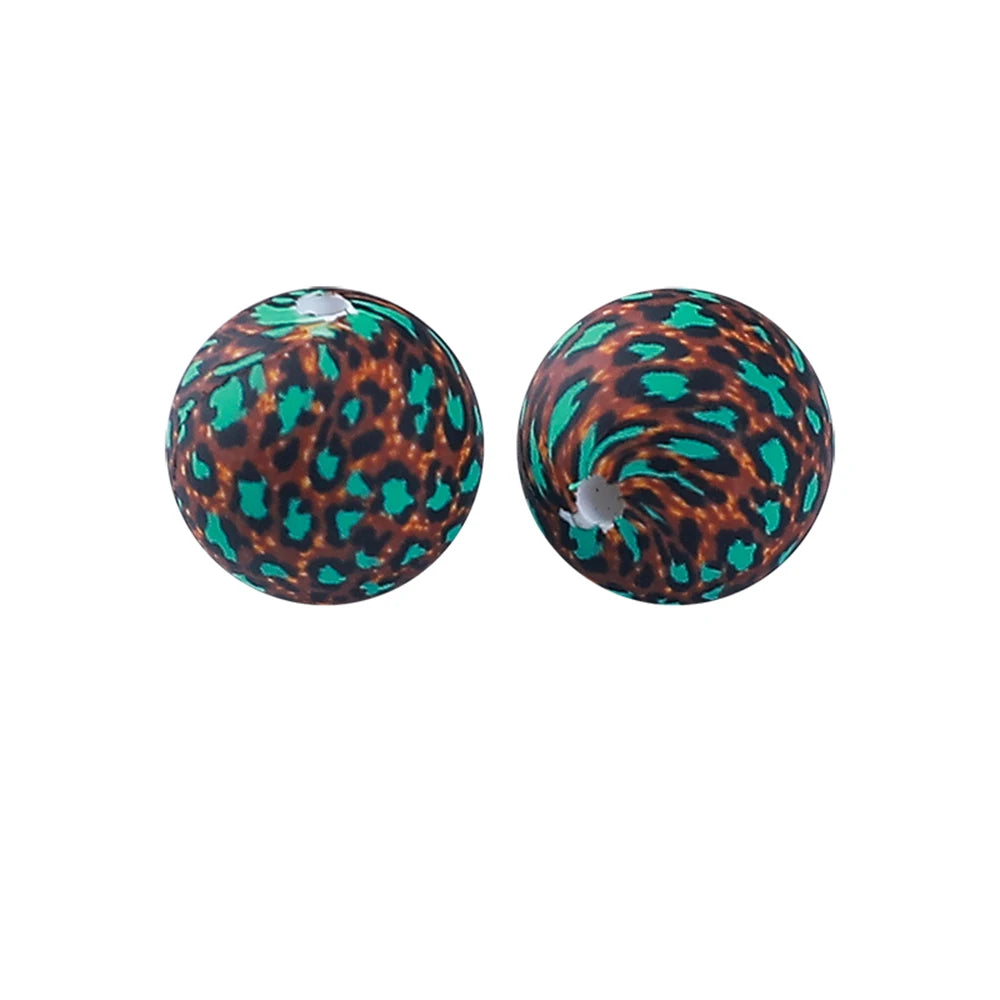 Pair of round, iridescent silicone beads with a leopard print design for jewelry making