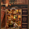 A detailed wooden model kit of a fossil museum book shelf with various dinosaur and prehistoric exhibits.