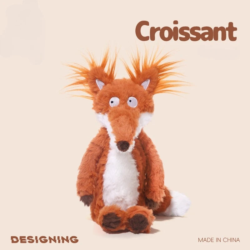 An orange fox plushie with white accents is displayed against a light background.
