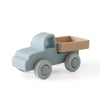 A light blue silicone toy car with a tan tray and wheels, designed for toddlers.