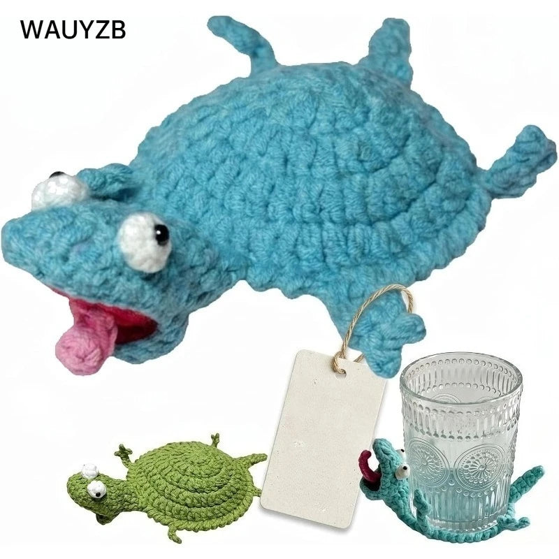 A handwoven crochet blue lizard figurine and a green lizard on a white tag.