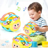 A baby is playing with a yellow and blue soft rubber hand ring and cute style fitness helper toy.