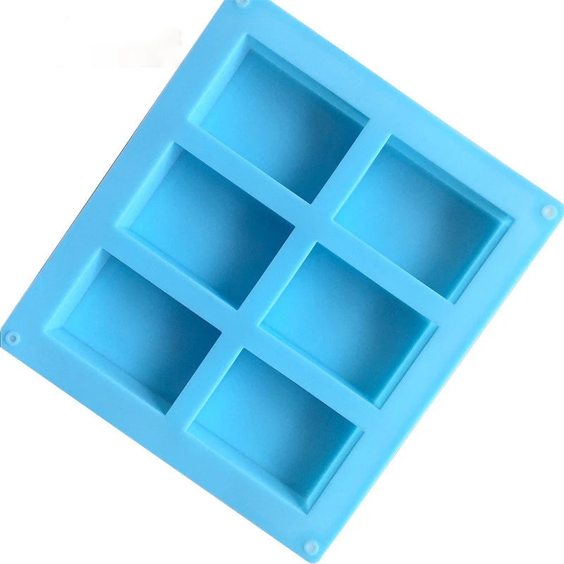 A square silicone mold with six cavities for making floral pattern soap