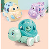 A set of soft rubber push and go friction cars for babies in various colors including yellow, purple, and teal.
